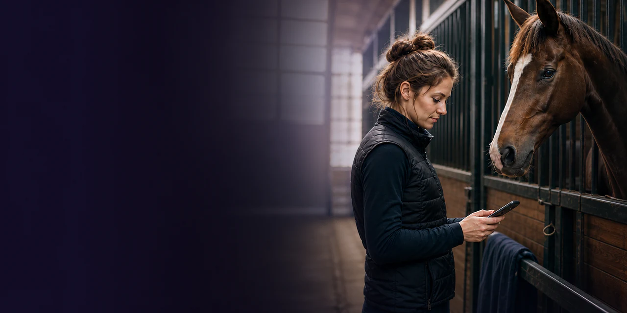 A stable owner using Trottica by a horse’s stall
